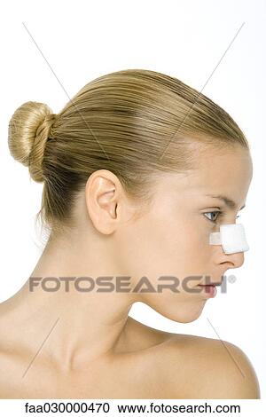 Woman with bandage on nose, profile View Large Photo Image Stock Image - Woman with bandage on nose, profile. Fotosearch