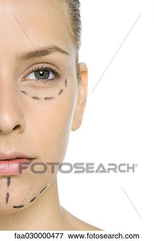 Woman with plastic surgery markings on face, close-up, cropped view View Large Photo Image Stock Photo - Woman with plastic surgery markings on face, close-up, cropped view. Fotosearch