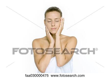Woman with plastic surgery markings under eyes, holding face, eyes closed View Large Photo Image Stock Photography - Woman with plastic surgery markings under eyes, holding face, eyes closed. Fotosearch