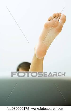 Woman's foot emerging from bathtub View Large Photo Image Stock Photography - Woman's foot emerging from bathtub. Fotosearch
