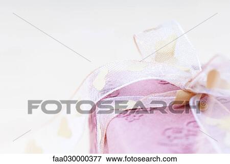 Wrapped gift, close-up View Large Photo Image Stock Photo - Wrapped gift, close-up. Fotosearch