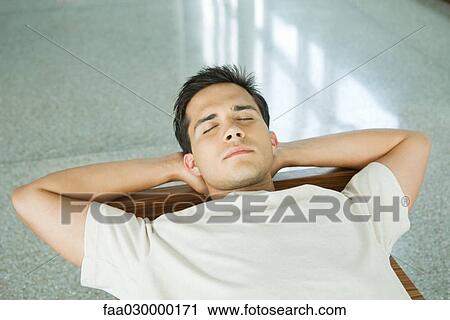 Young man napping View Large Photo Image Stock Image - Young man napping. Fotosearch