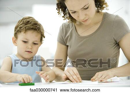 Young mother with boy View Large Photo Image Stock Image - Young mother with boy. Fotosearch