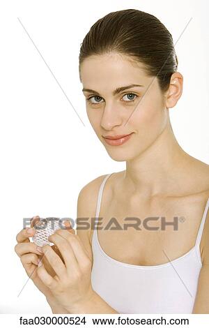 Young woman using nail brush, smiling at camera View Large Photo Image Picture - Young woman using nail brush, smiling at camera. Fotosearch