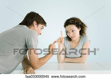 Couple arguing, making gestures, waist up View Large Photo Image Stock Photography - Couple arguing, making gestures, waist up. Fotosearch
