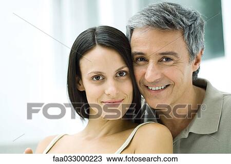 Couple cheek to cheek, smiling at camera, portrait View Large Photo Image Stock Image - Couple cheek to cheek, smiling at camera, portrait. Fotosearch