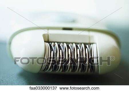 Electric epilator, close-up View Large Photo Image Stock Photo - Electric epilator, close-up. Fotosearch
