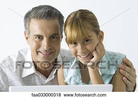 Father and daughter smiling at camera, portrait View Large Photo Image Stock Photo - Father and daughter smiling at camera, portrait. Fotosearch