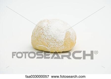 Stock Photo - Freshly kneaded ball of dough, close-up. Fotosearch