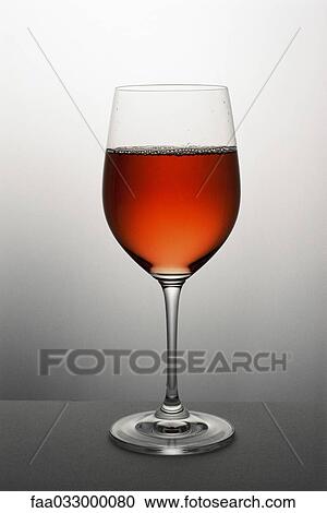 Glass of rose wine, close-up View Large Photo Image Stock Image - Glass of rose wine, close-up. Fotosearch