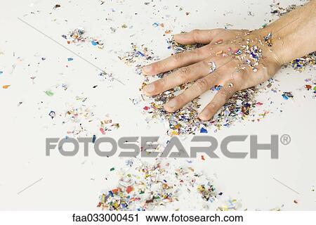 Hand covered with confetti View Large Photo Image Stock Image - Hand covered with confetti. Fotosearch