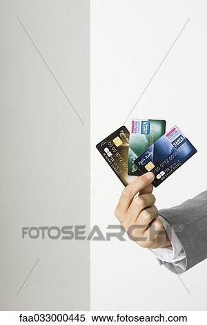 Hand holding credit cards View Large Photo Image Stock Photography - Hand holding credit cards. Fotosearch