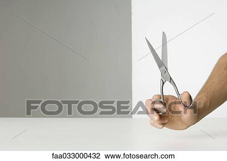 Hand holding scissors View Large Photo Image Stock Image - Hand holding scissors. Fotosearch