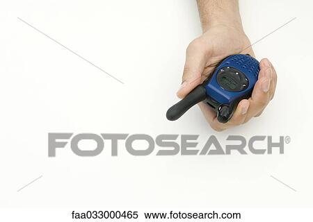 Hand holding walkie-talkie View Large Photo Image Stock Photography - Hand holding walkie-talkie. Fotosearch