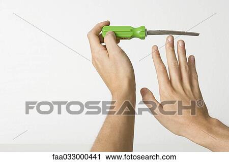 Hands holding sharp file View Large Photo Image Stock Image - Hands holding sharp file. Fotosearch