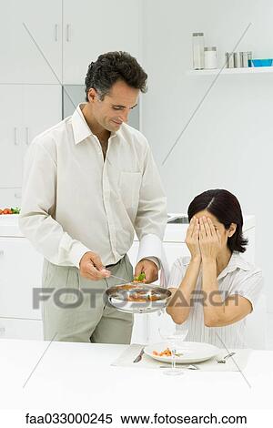 Husband serving wife surprise meal, woman covering eyes with hands View Large Photo Image Stock Photography - Husband serving wife surprise meal, woman covering eyes with hands. Fotosearch