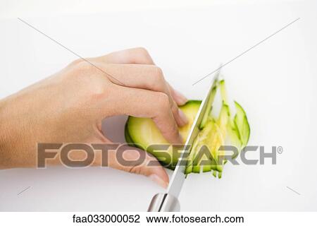 Knife cutting summer squash (zapallito redondo), hand holding in place, cropped view View Large Photo Image Stock Image - Knife cutting summer squash (zapallito redondo), hand holding in place, cropped view. Fotosearch