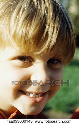 Little boy smiling at camera, sunny, portrait View Large Photo Image Stock Image - Little boy smiling at camera, sunny, portrait. Fotosearch