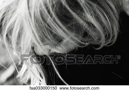 Little girl looking down, hair in front of face, cropped portrait View Large Photo Image Stock Image - Little girl looking down, hair in front of face, cropped portrait. Fotosearch