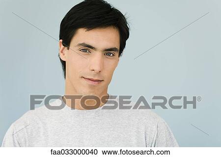 Stock Image - Man smiling at camera, portrait. Fotosearch