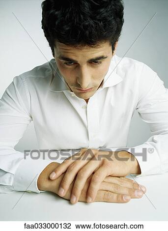 Man with head down, clasped hands, portrait View Large Photo Image Stock Image - Man with head down, clasped hands, portrait. Fotosearch