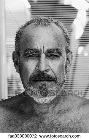 Mature man looking at camera, portrait View Large Photo Image Stock Image - Mature man looking at camera, portrait. Fotosearch