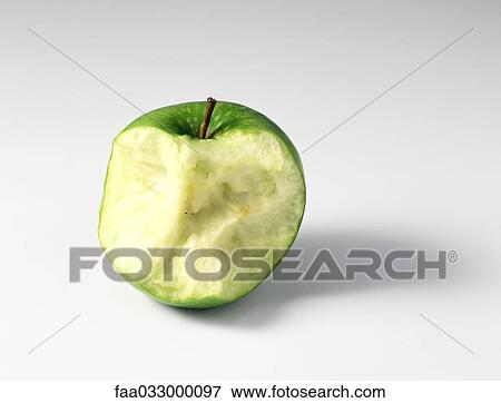Partially eaten apple, close-up View Large Photo Image Stock Photo - Partially eaten apple, close-up. Fotosearch