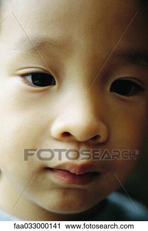 Stock Image - Toddler boy, portrait, close-up. Fotosearch