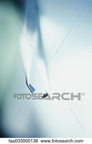 Tweezers, extreme close-up, selective focus View Large Photo Image Stock Photo - Tweezers, extreme close-up, selective focus. Fotosearch