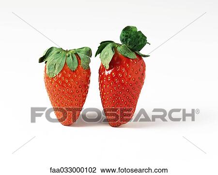 Stock Image - Two strawberries, close-up. Fotosearch