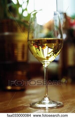 Picture - White wine in glass. Fotosearch