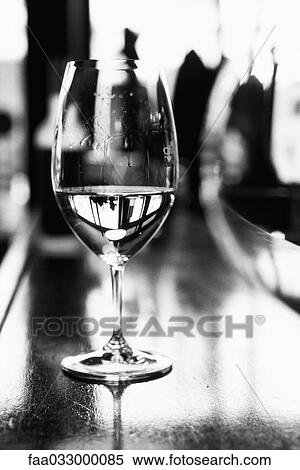 Stock Photography - Wine glass on bar counter. Fotosearch