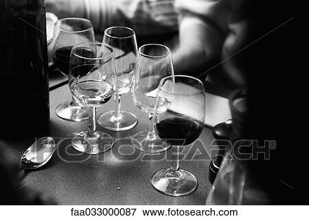 Wine glasses on counter, some empty View Large Photo Image Stock Photo - Wine glasses on counter, some empty. Fotosearch