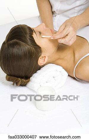 Woman having face moisturized, eyes closed View Large Photo Image Stock Photo - Woman having face moisturized, eyes closed. Fotosearch