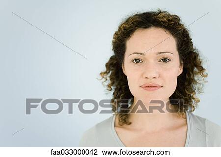 Stock Image - Woman looking at camera, portrait. Fotosearch