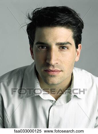 Young man looking at camera, portrait View Large Photo Image Stock Photography - Young man looking at camera, portrait. Fotosearch