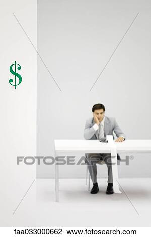 Accountant using adding machine, holding head, dollar sign in foreground View Large Photo Image Stock Image - Accountant using adding machine, holding head, dollar sign in foreground. Fotosearch