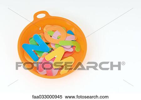 Stock Photography - Alphabet letters in plastic dish. Fotosearch