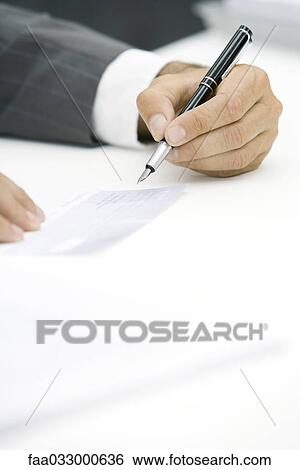 Businessman signing check, cropped view of hand View Large Photo Image Stock Photograph - Businessman signing check, cropped view of hand. Fotosearch