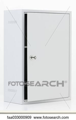 Stock Photo - Cabinet with door slightly ajar, key in lock. Fotosearch