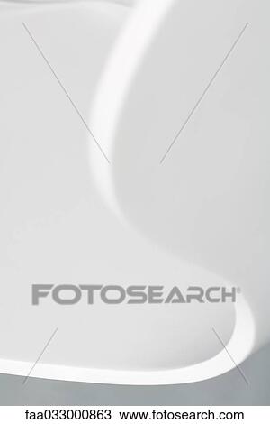 Stock Image - Close-up of curved chair. Fotosearch