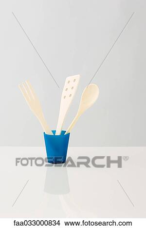 Picture - Cooking utensils stored in cup. Fotosearch