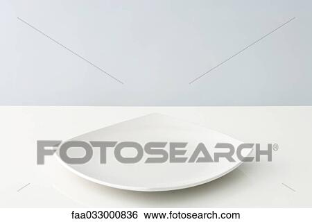 Stock Photograph - Curved plate, close-up. Fotosearch