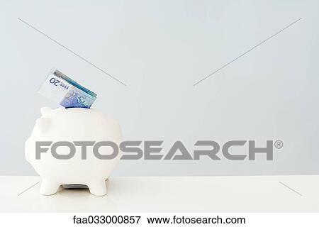 Folded twenty euro bill sticking out of piggy bank View Large Photo Image Stock Photo - Folded twenty euro bill sticking out of piggy bank. Fotosearch