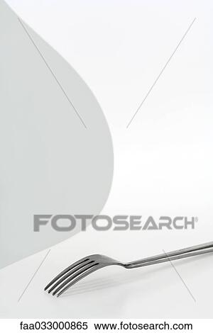 Stock Photography - Fork on a chair, close-up. Fotosearch