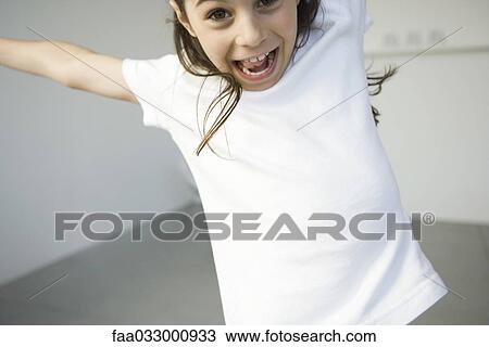 Girl screaming with her arms out, cropped view View Large Photo Image Stock Image - Girl screaming with her arms out, cropped view. Fotosearch
