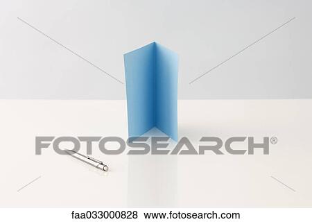 Stock Photo - Greeting card standing upright, pen lying nearby. Fotosearch