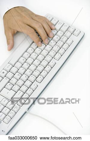 Hand typing on keyboard, high angle view View Large Photo Image Stock Image - Hand typing on keyboard, high angle view. Fotosearch