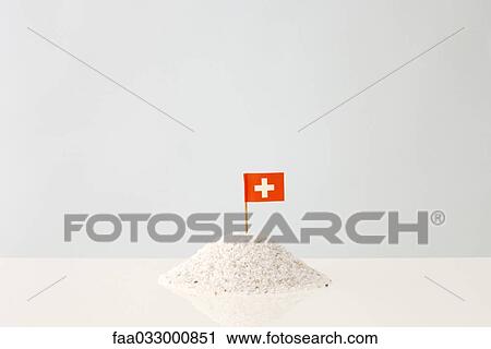 Heap of gravel with tiny flag of Switzerland sticking out of it View Large Photo Image Stock Image - Heap of gravel with tiny flag of Switzerland sticking out of it. Fotosearch