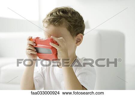 Little boy looking in toy view finder View Large Photo Image Picture - Little boy looking in toy view finder. Fotosearch